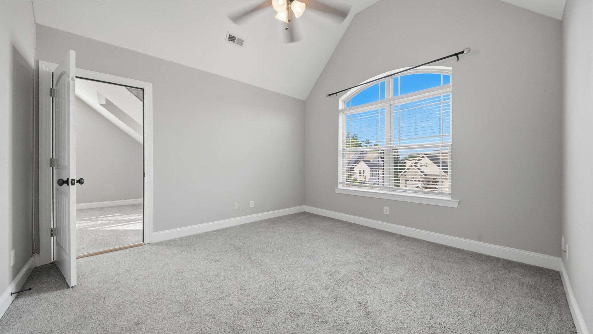 4046 Brock Road Chattanooga, TN 37421 - Photo 44 of 59 an empty room with windows and chandelier fan
