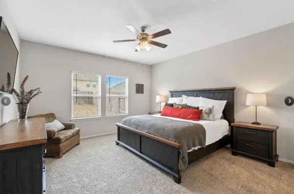 a bedroom with a bed and a couch