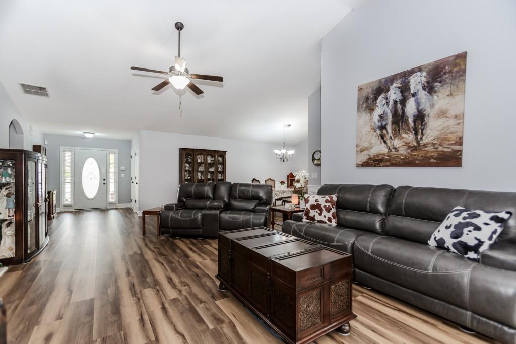 1411 Silvergate Way Winder, GA 30680 - Photo 11 of 38 a living room with furniture and wooden floor