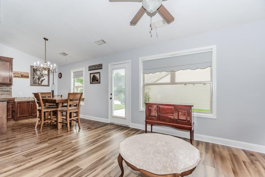 1411 Silvergate Way Winder, GA 30680 - Photo 13 of 38 a living room with furniture and wooden floor