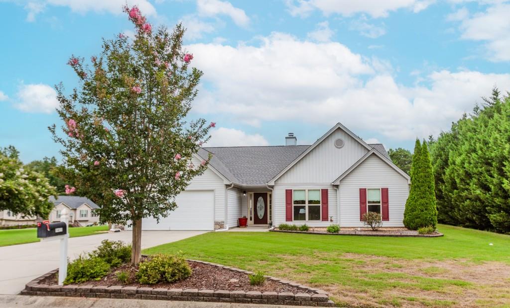 1411 Silvergate Way Winder, GA 30680 - Photo 2 of 38 a view of a house with a yard