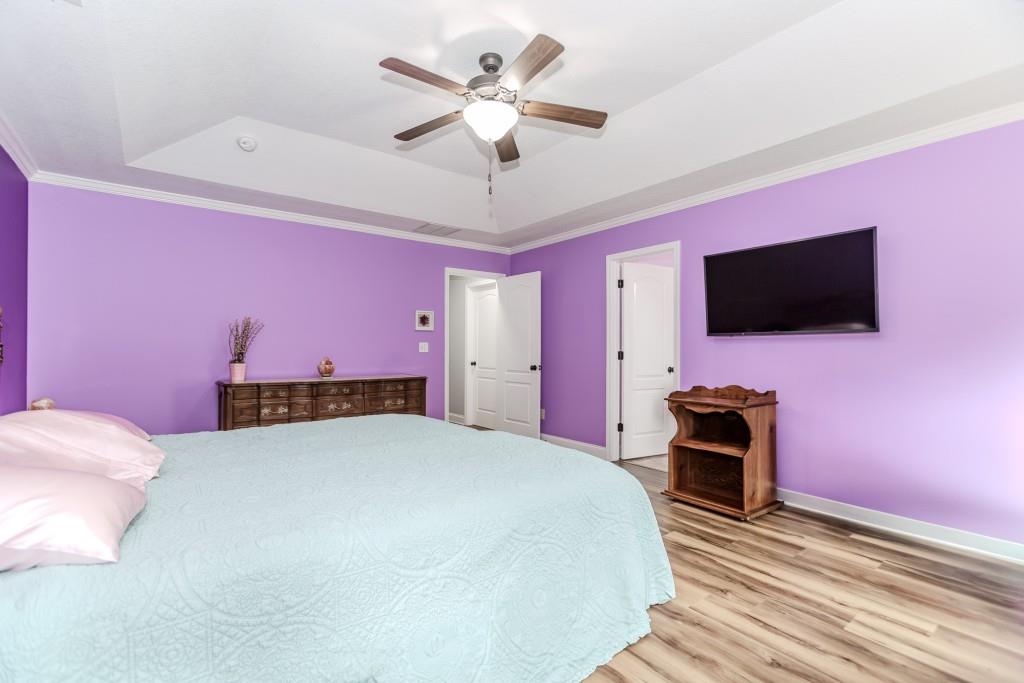 1411 Silvergate Way Winder, GA 30680 - Photo 22 of 38 a bedroom with a bed and a flat screen tv