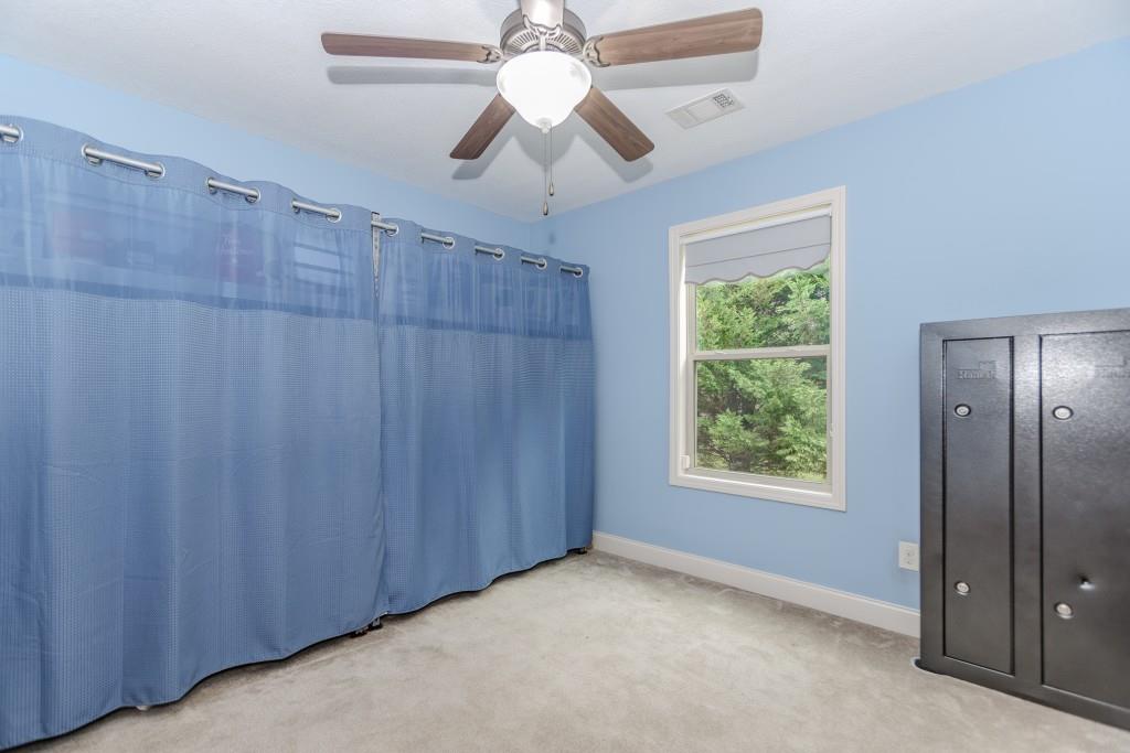 1411 Silvergate Way Winder, GA 30680 - Photo 32 of 38 a view of an empty room with a window