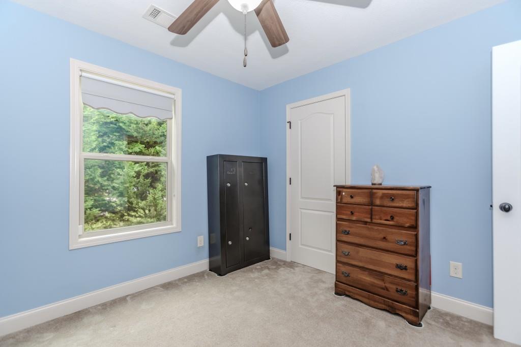 1411 Silvergate Way Winder, GA 30680 - Photo 33 of 38 an empty room with windows and closet