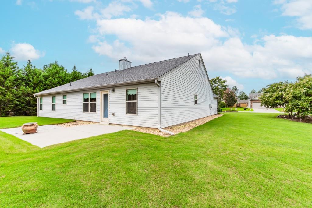 1411 Silvergate Way Winder, GA 30680 - Photo 36 of 38 a view of a white house with a backyard