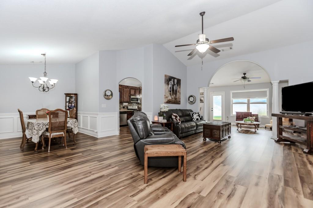 1411 Silvergate Way Winder, GA 30680 - Photo 9 of 38 a living room with furniture a flat screen tv and a window