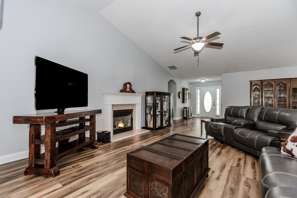 1411 Silvergate Way Winder, GA 30680 - Photo 10 of 38 a living room with furniture and a flat screen tv