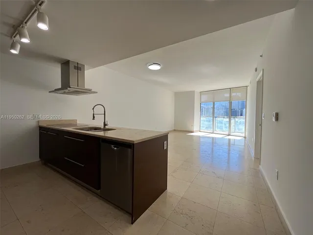 a kitchen with a sink and a window