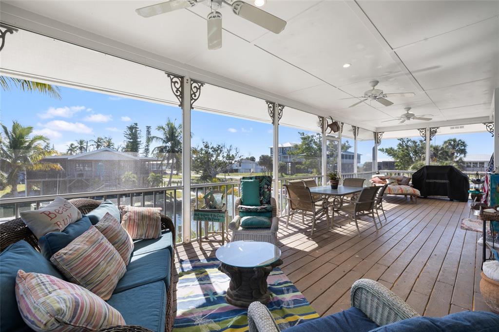 9712 Little Gasparilla Placida, FL 33946 - Photo 14 of 58 a living room with furniture and a large window