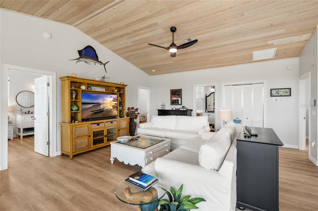 9712 Little Gasparilla Placida, FL 33946 - Photo 29 of 58 a living room with furniture and a flat screen tv