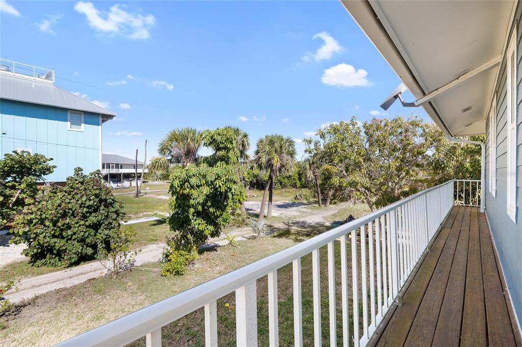 9712 Little Gasparilla Placida, FL 33946 - Photo 43 of 58 a view of a balcony with flower plants