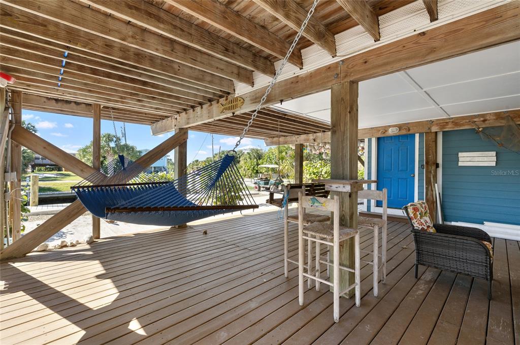 9712 Little Gasparilla Placida, FL 33946 - Photo 49 of 58 a view of a patio with table and chairs