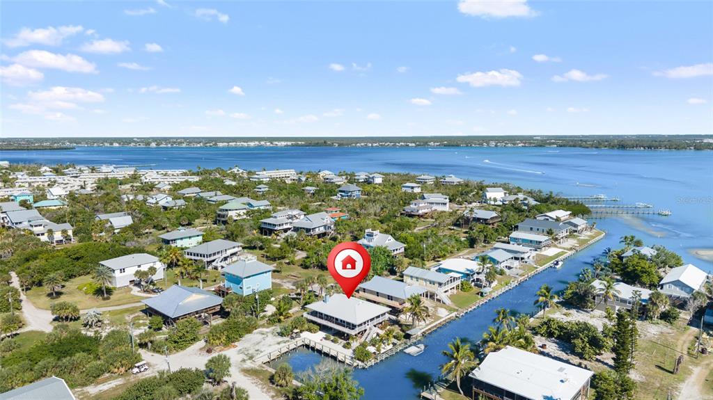 9712 Little Gasparilla Placida, FL 33946 - Photo 7 of 58 an aerial view of residential houses with outdoor space