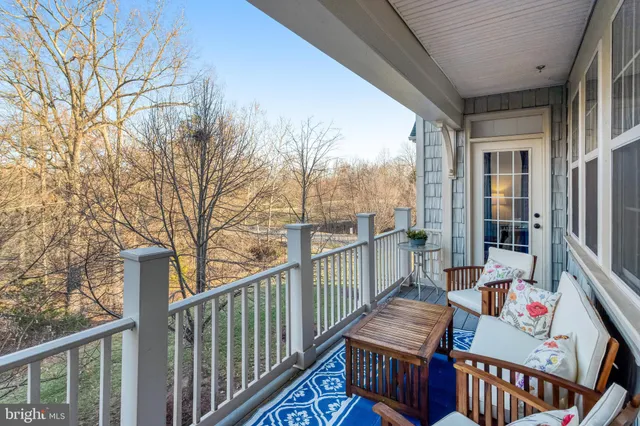 a balcony with furniture and wooden deck
