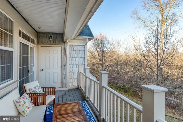 a view of a house with backyard and wooden floor