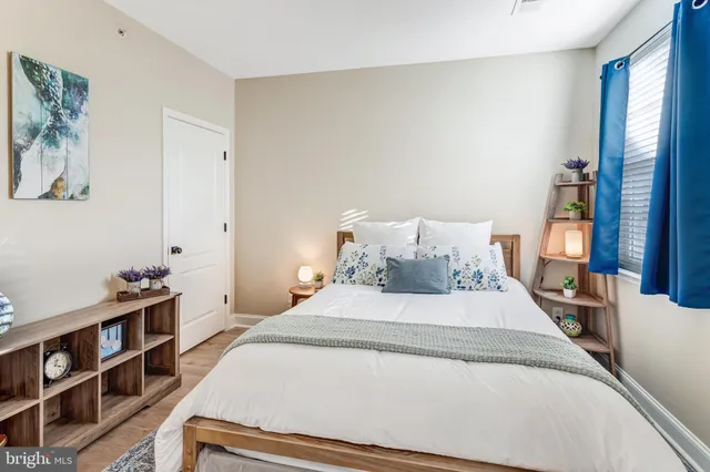 a bedroom with a bed and a book shelf