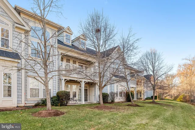 a front view of a building with a yard