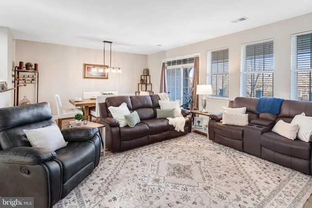 a living room with furniture and windows