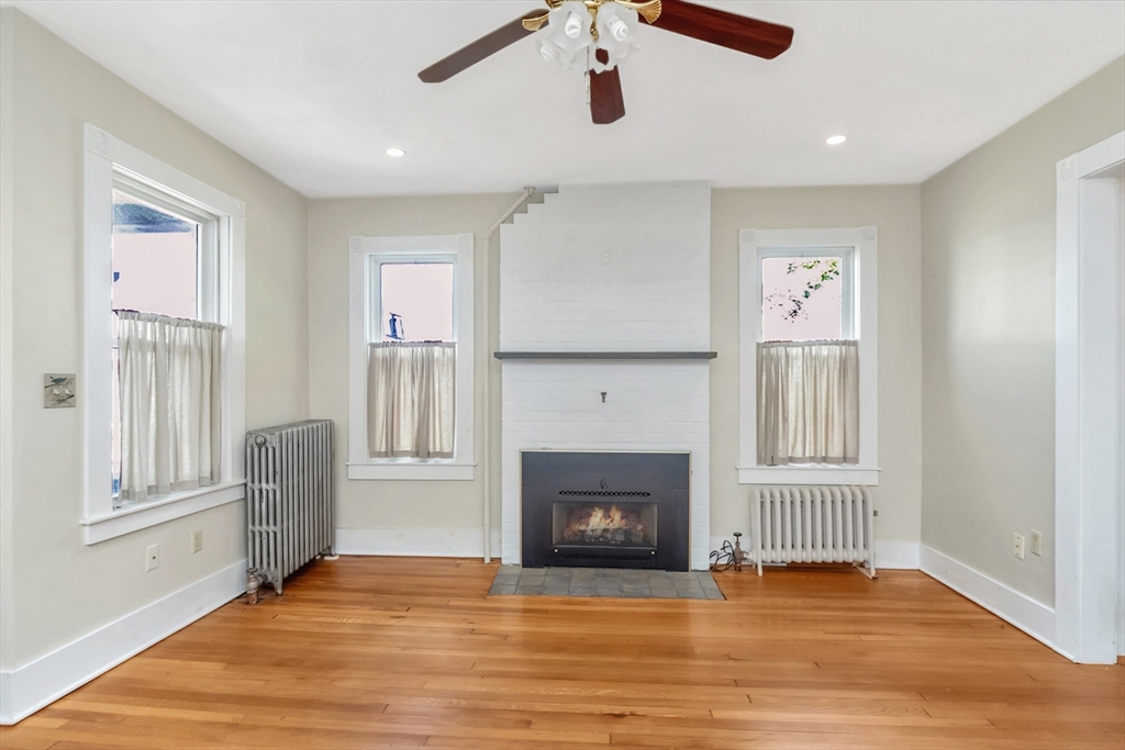 89 1/2 Walnut Street Clinton, MA 01510 - Photo 13 of 36 a view of livingroom with hardwood floor and window