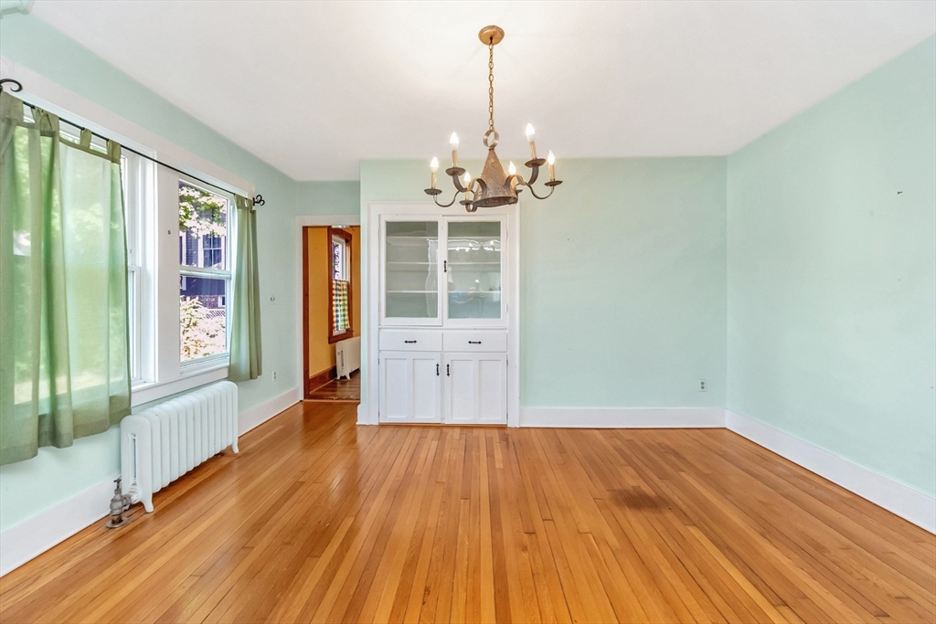 89 1/2 Walnut Street Clinton, MA 01510 - Photo 16 of 36 a view of a room with wooden floor staircase and windows