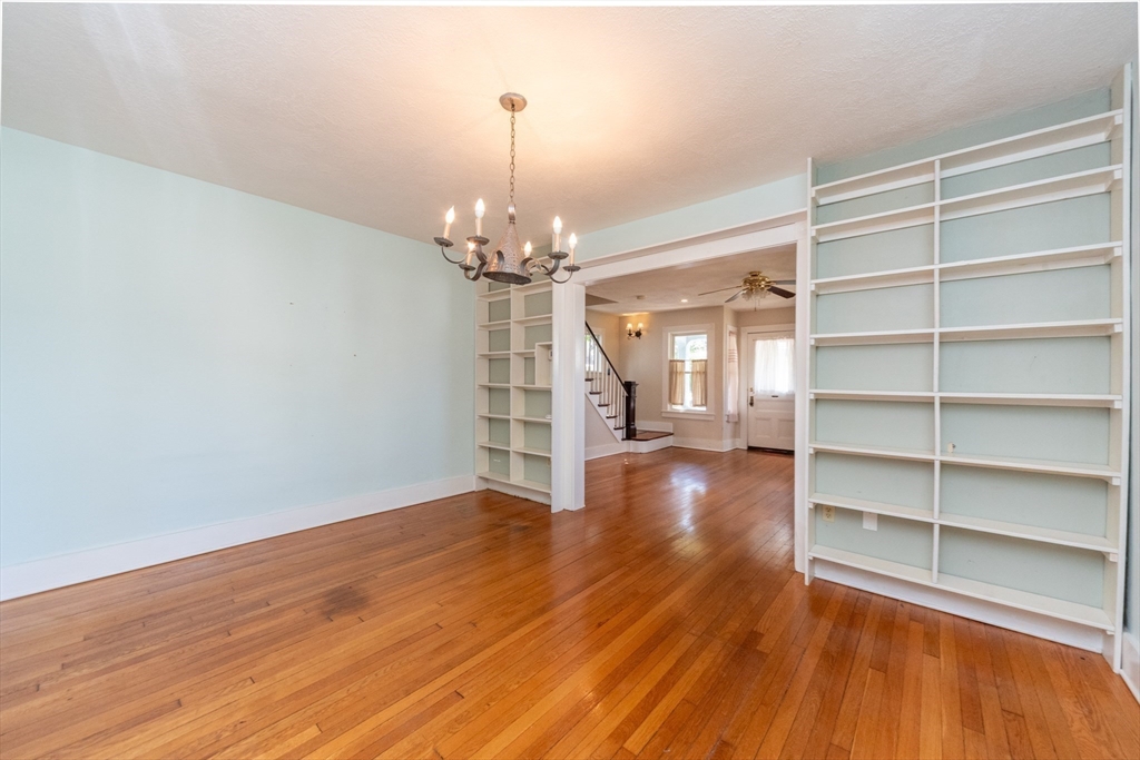 89 1/2 Walnut Street Clinton, MA 01510 - Photo 18 of 36 a view of a livingroom with wooden floor and staircase