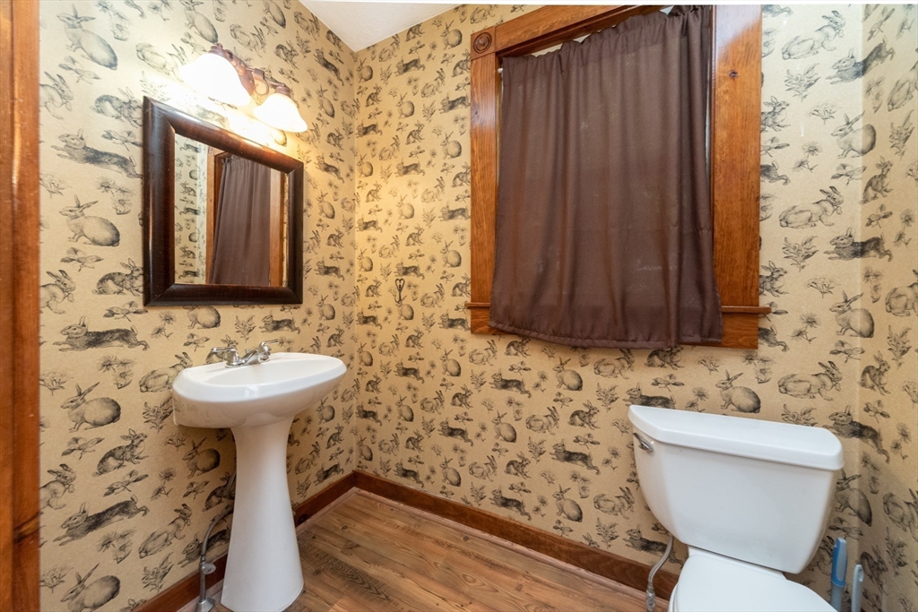 89 1/2 Walnut Street Clinton, MA 01510 - Photo 19 of 36 a bathroom with a sink and a toilet