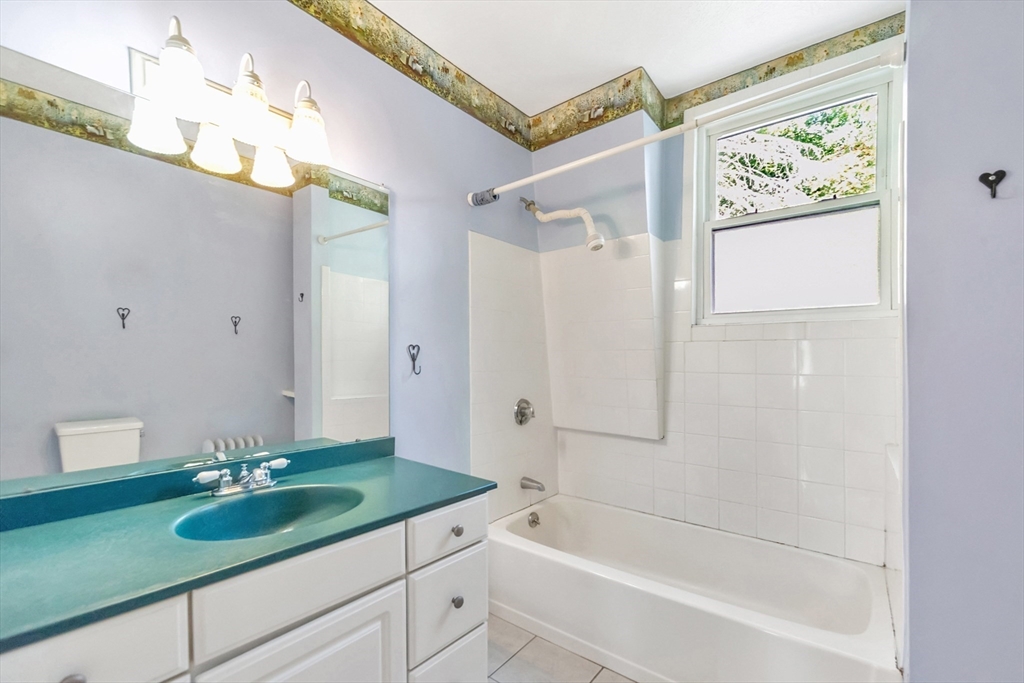 89 1/2 Walnut Street Clinton, MA 01510 - Photo 29 of 36 a bathroom with a bathtub and a sink