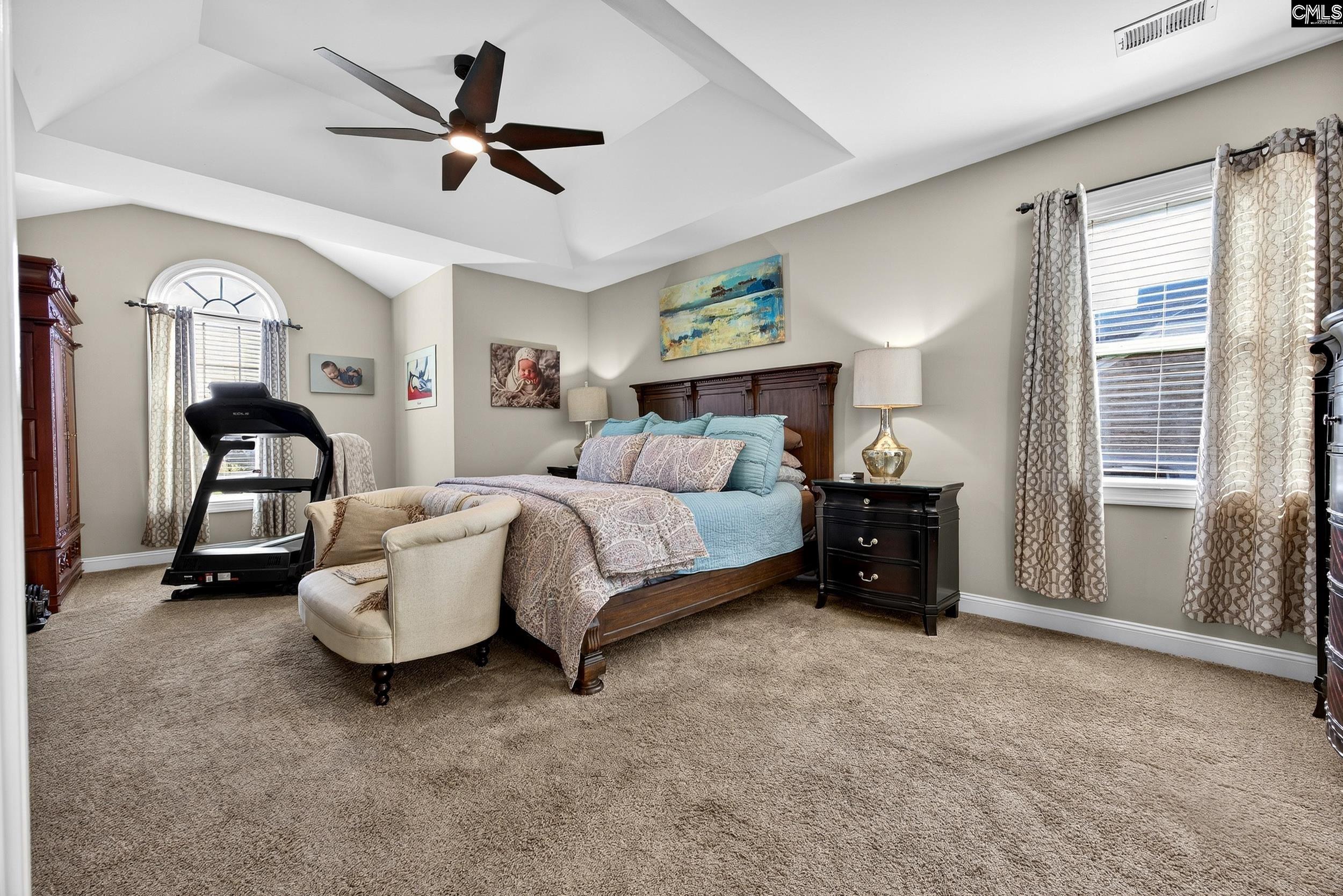 116 Renard Way Gilbert, SC 29054 - Photo 33 of 74 a spacious bedroom with a bed and a couch