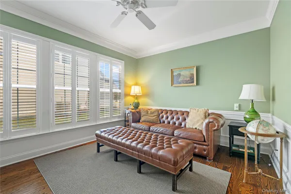 a kitchen with granite countertop kitchen island stainless steel appliances a stove refrigerator sink microwave and cabinets