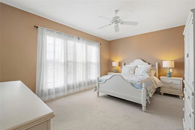 a group of people sitting in front of a house