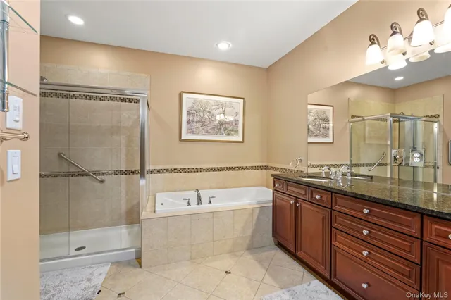 a bathroom with a granite countertop sink mirror and toilet