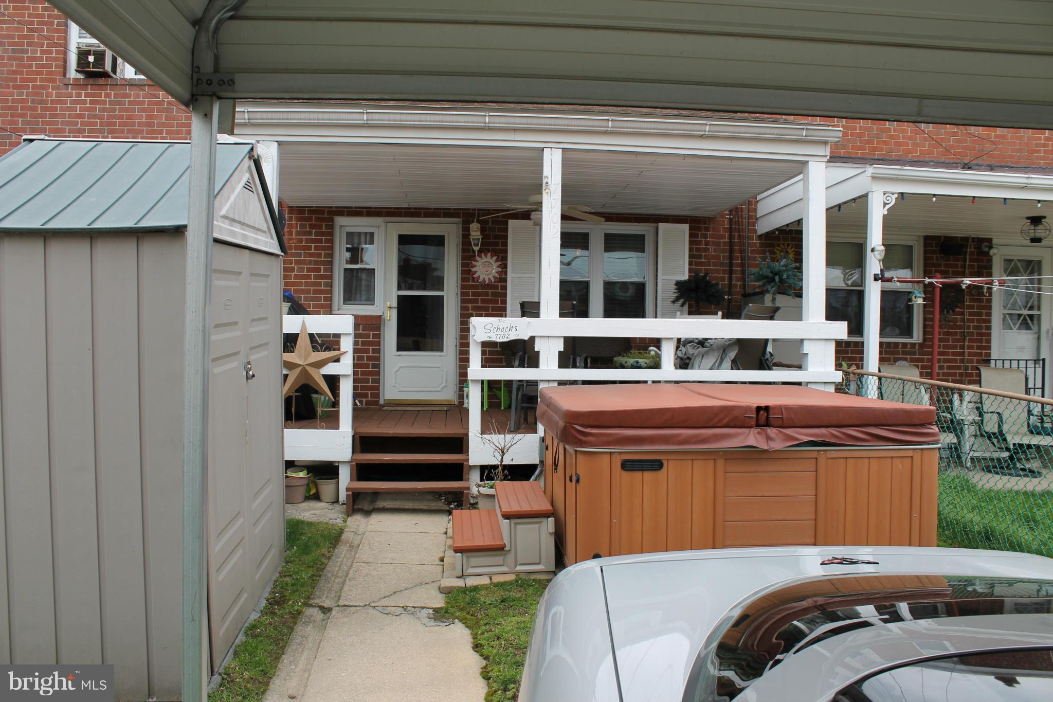 7702 Charlesmont Road Baltimore, MD 21222 - Photo 3 of 13 a view of a car park in front of house