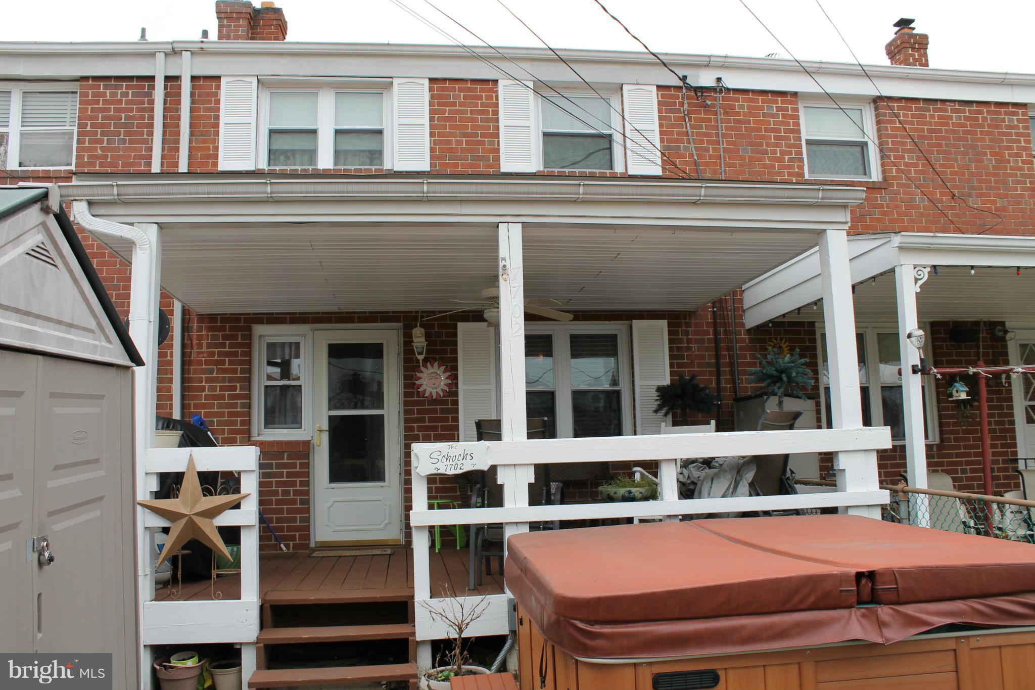 7702 Charlesmont Road Baltimore, MD 21222 - Photo 4 of 13 front view of a building with a balcony
