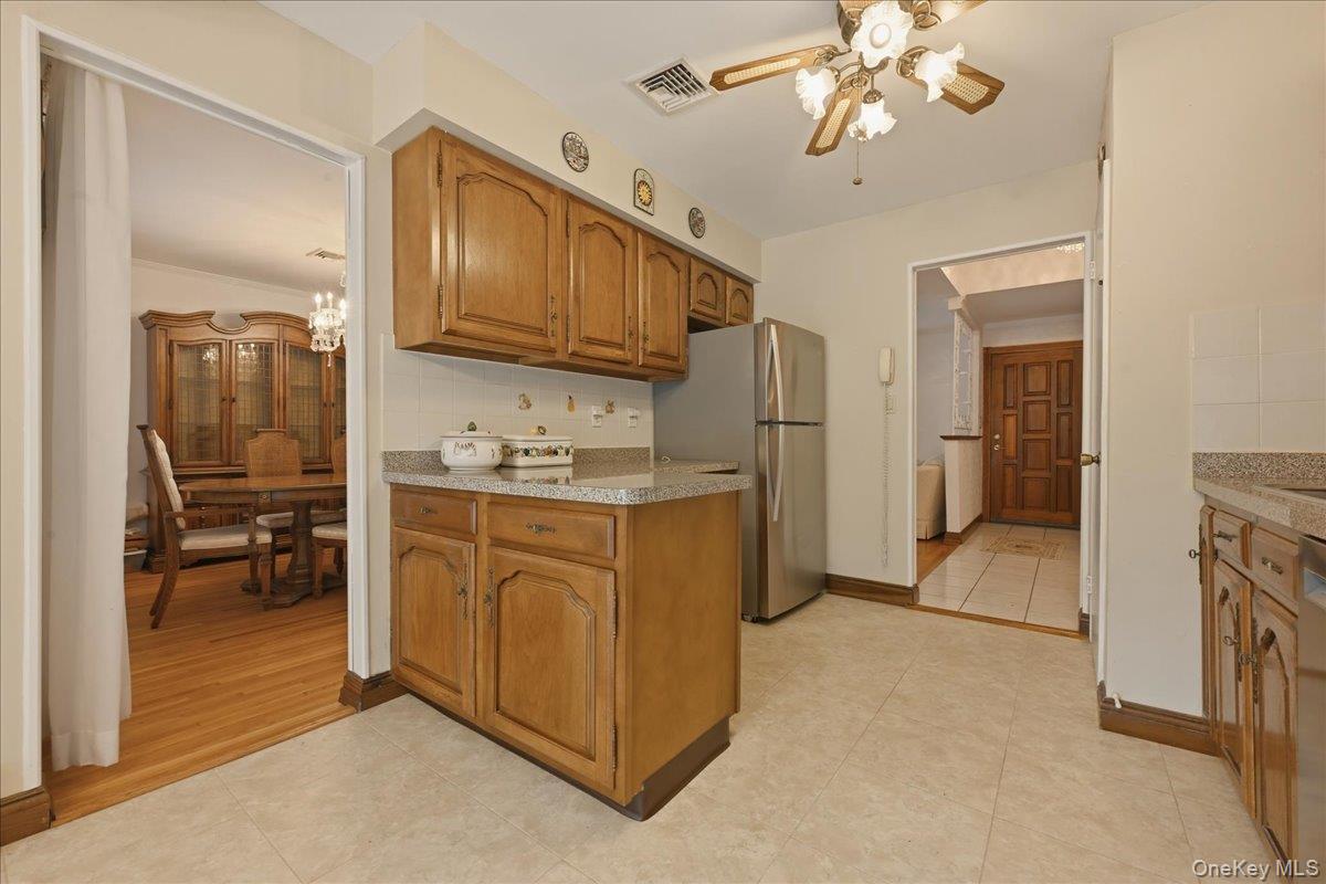 17 Avon Road Farmingdale, NY 11735 - Photo 12 of 46 a kitchen with cabinets a oven and a refrigerator