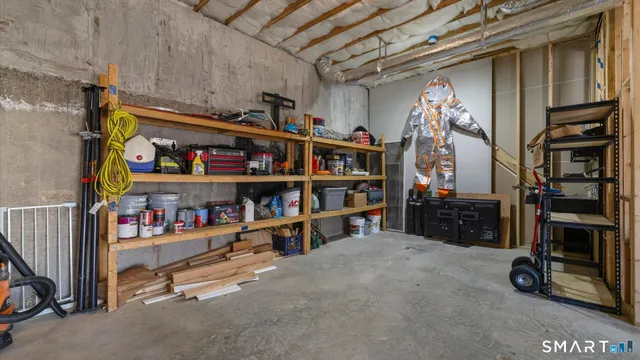 a view of a deck with table and chairs with wooden floor and fence