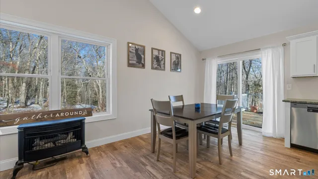 a kitchen with stainless steel appliances granite countertop a stove top oven a refrigerator a sink and a granite counter tops