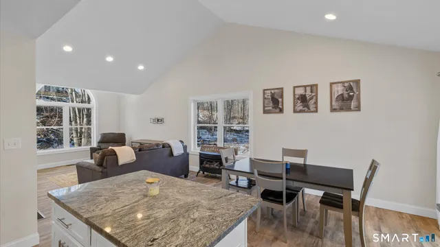 a bedroom with a bed and a night stand