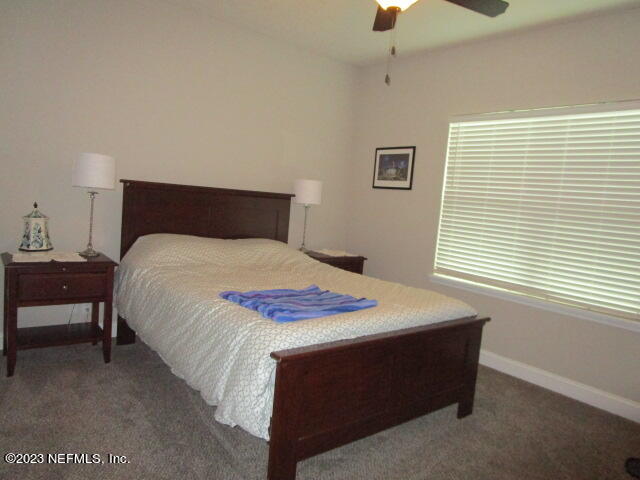3704 Pete Johnson Road Macclenny, FL 32063 - Photo 15 of 18 a bedroom with a bed and a window