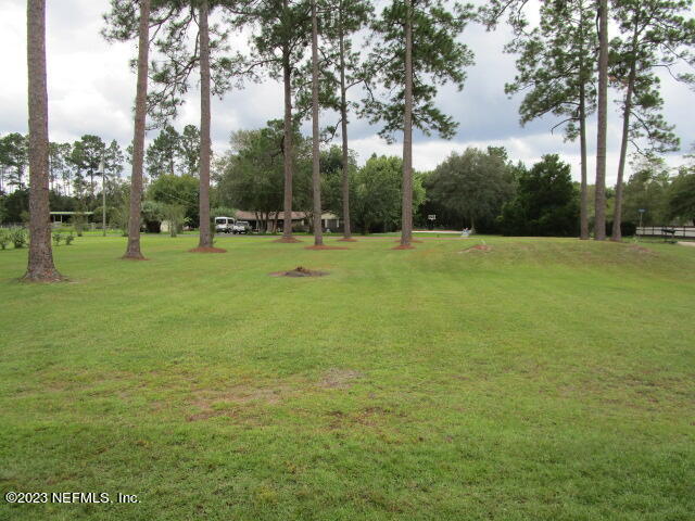 3704 Pete Johnson Road Macclenny, FL 32063 - Photo 18 of 18 a view of outdoor space with deck and yard