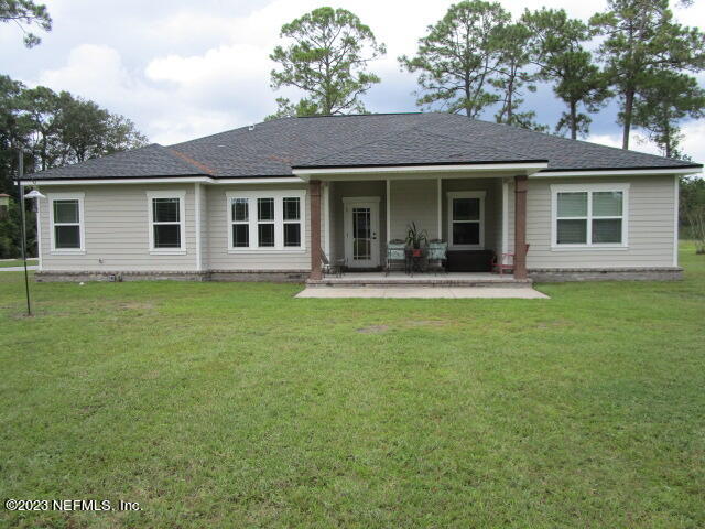 3704 Pete Johnson Road Macclenny, FL 32063 - Photo 2 of 18 a front view of house with yard and outdoor seating
