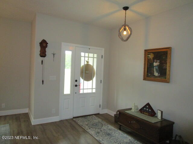3704 Pete Johnson Road Macclenny, FL 32063 - Photo 4 of 18 a view of empty room with wooden floor and fan