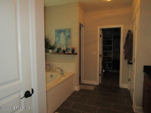 3704 Pete Johnson Road Macclenny, FL 32063 - Photo 10 of 18 a bathroom with a bathtub and a shower