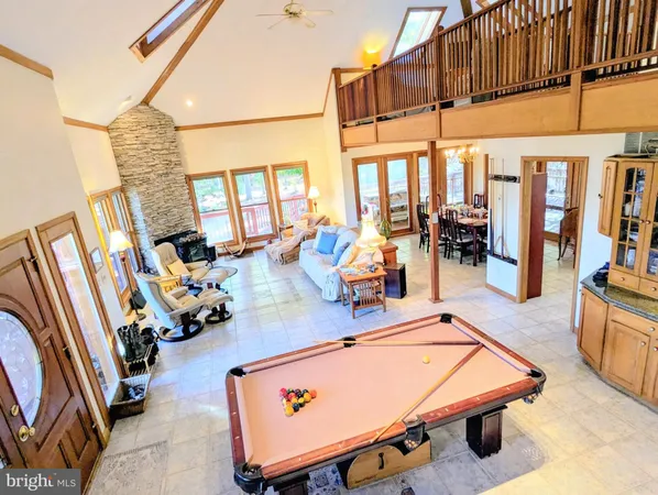 a kitchen with stainless steel appliances granite countertop a stove and cabinets