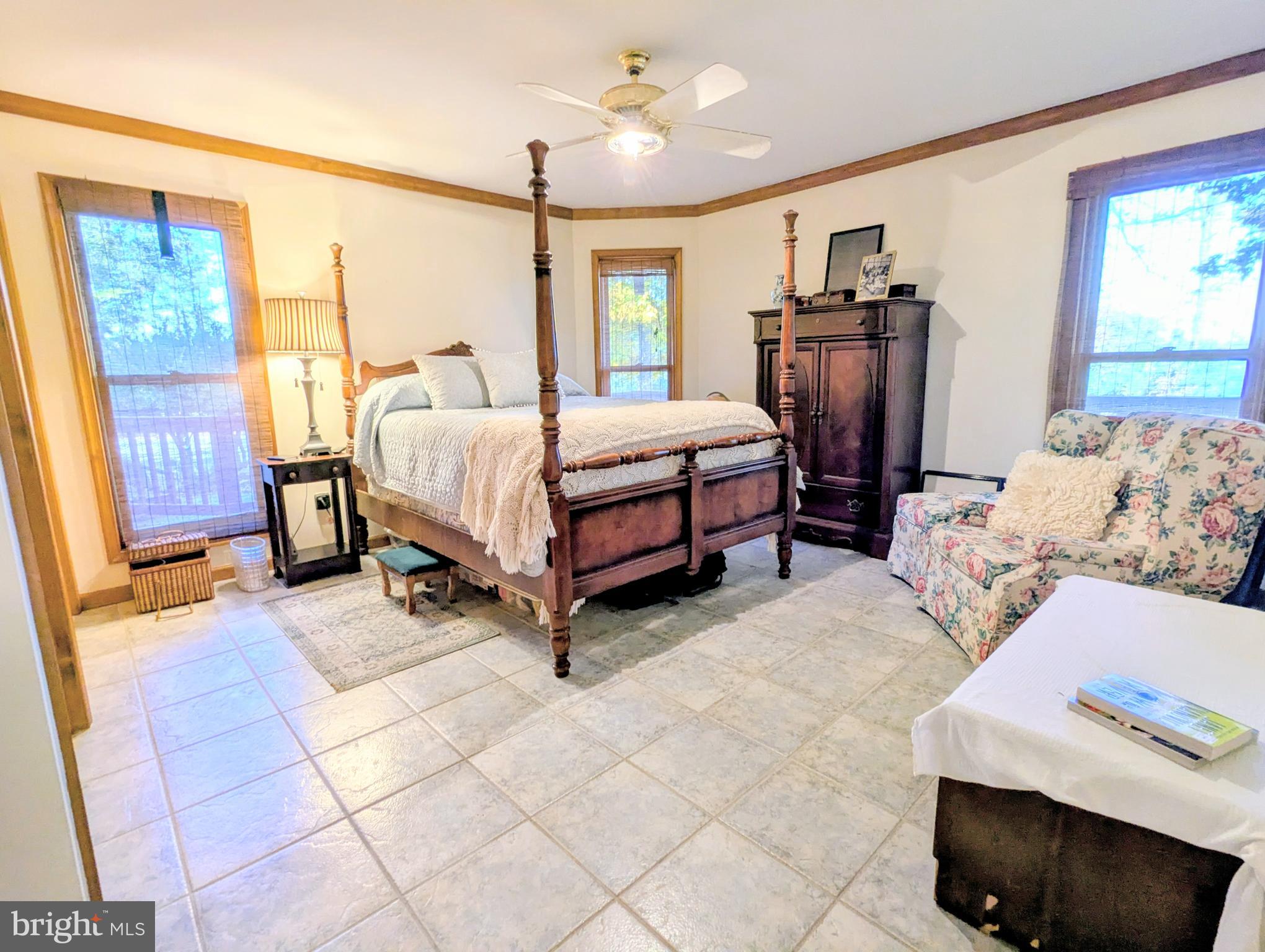 2006 Bennett Point Road Queenstown, MD 21658 - Photo 43 of 58 a bedroom with a bed dresser and a window
