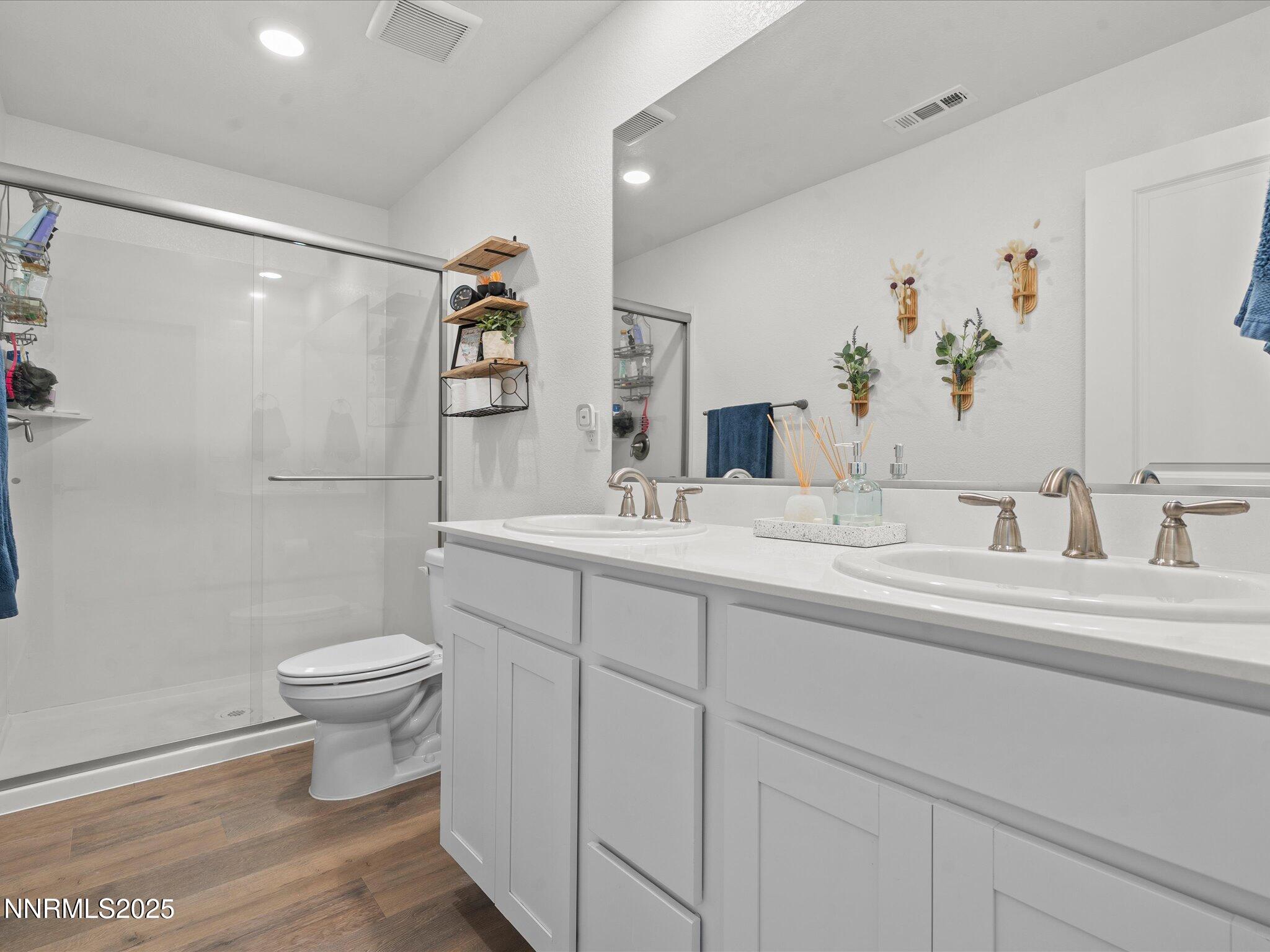 4232 Fawnridge Place Reno, NV 89523 - Photo 11 of 39 a bathroom with a sink and a mirror