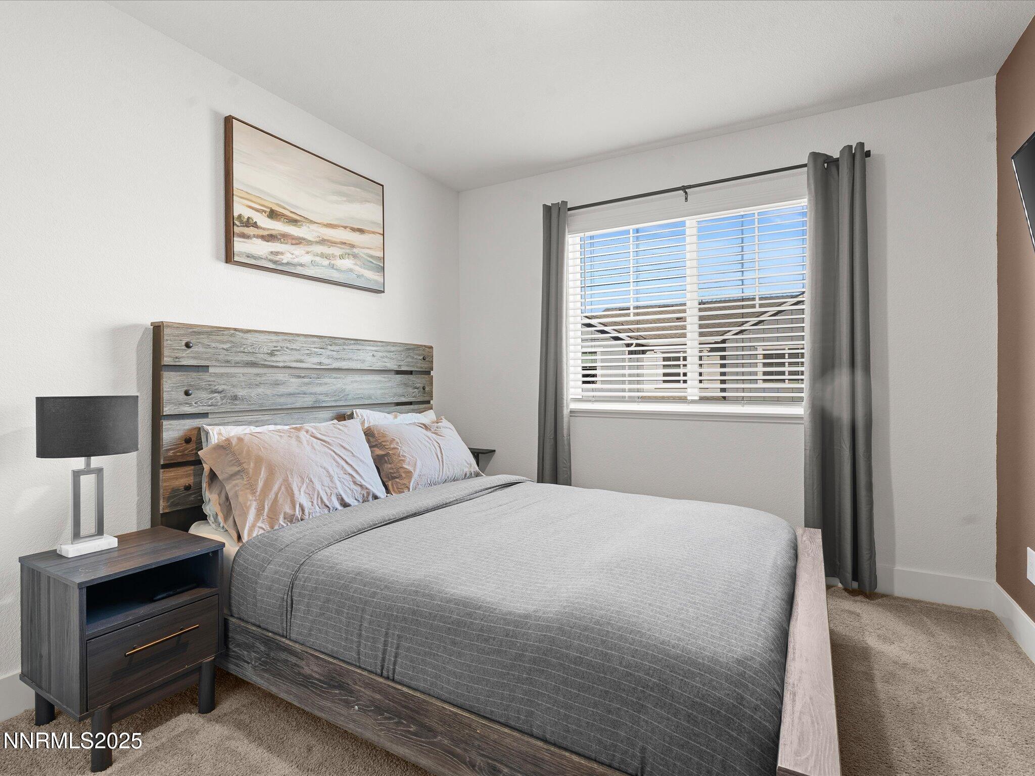 4232 Fawnridge Place Reno, NV 89523 - Photo 14 of 39 a bedroom with a bed and a window
