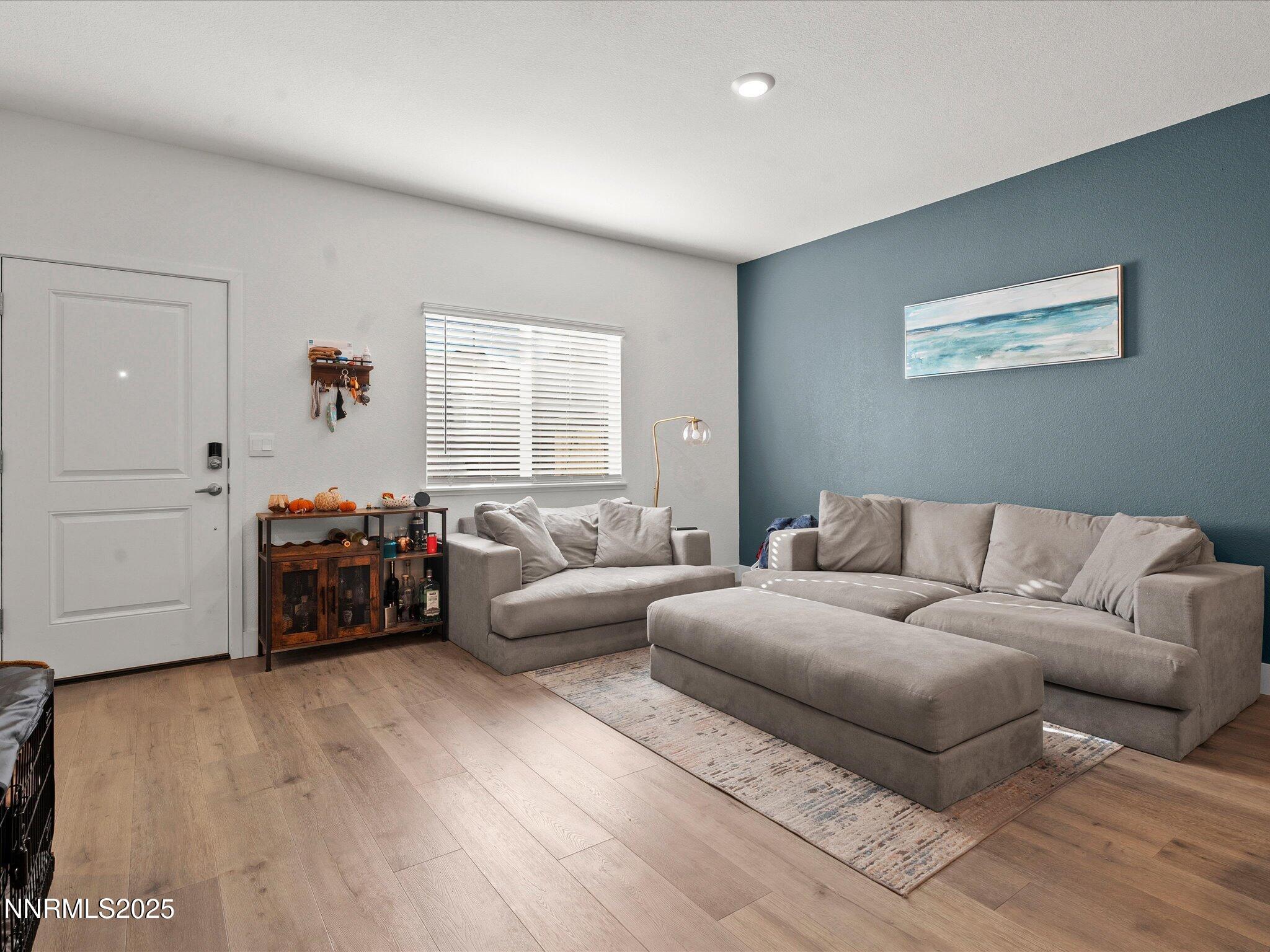 4232 Fawnridge Place Reno, NV 89523 - Photo 2 of 39 a living room with furniture and a wooden floor