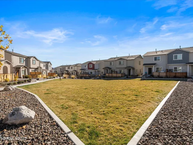 a view of residential houses with ocean view