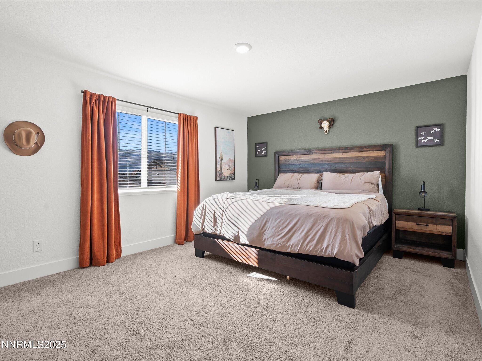 4232 Fawnridge Place Reno, NV 89523 - Photo 9 of 39 a spacious bedroom with a bed and a window