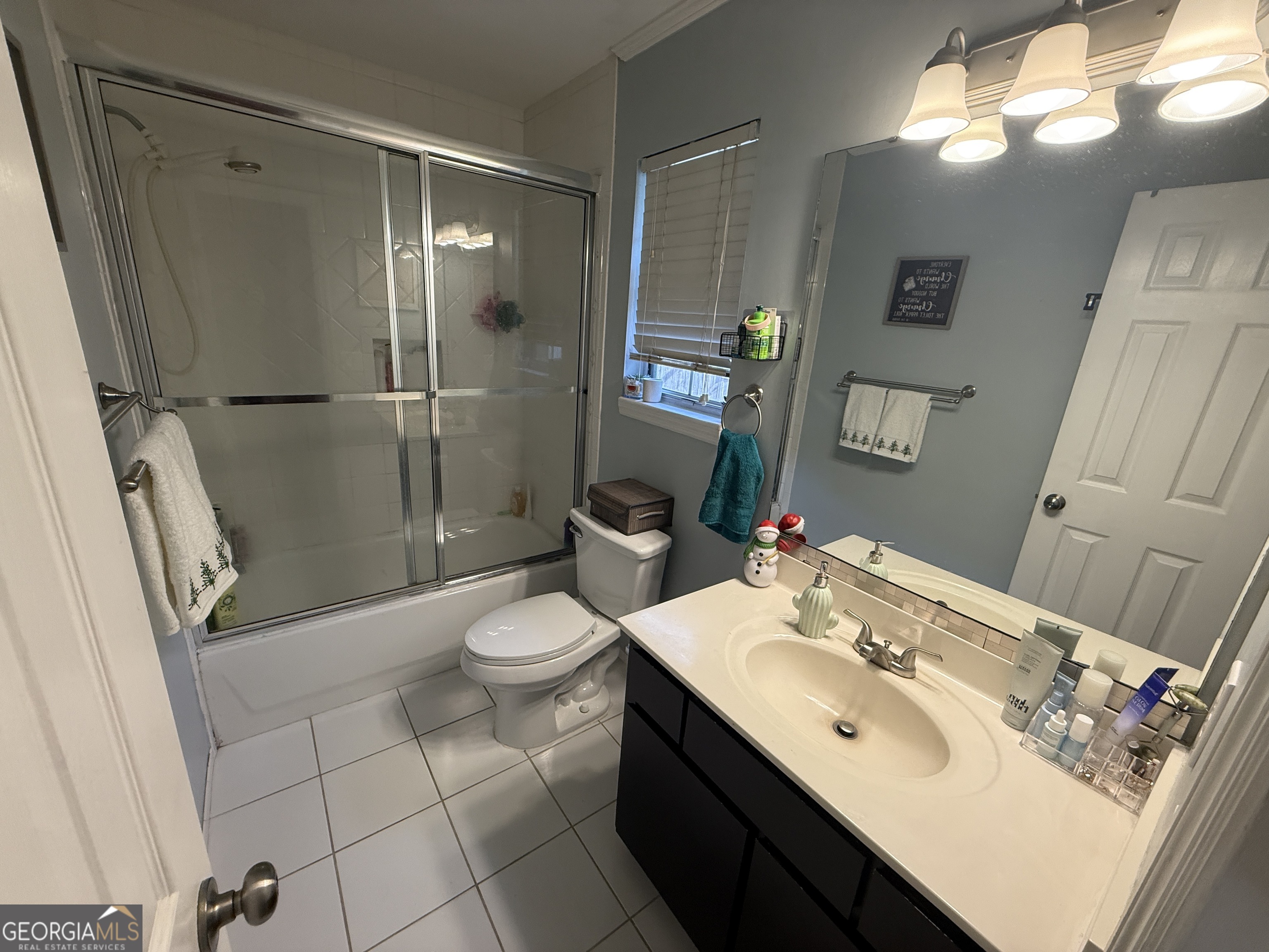2203 Windsor Street St. Marys, GA 31558 - Photo 11 of 15 a bathroom with a sink toilet and shower